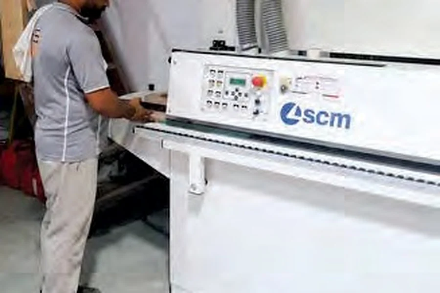 Craftsman operating joinery machinery